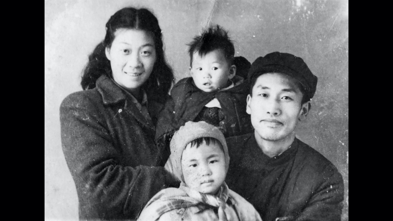 old family photograph: two parents and two kids