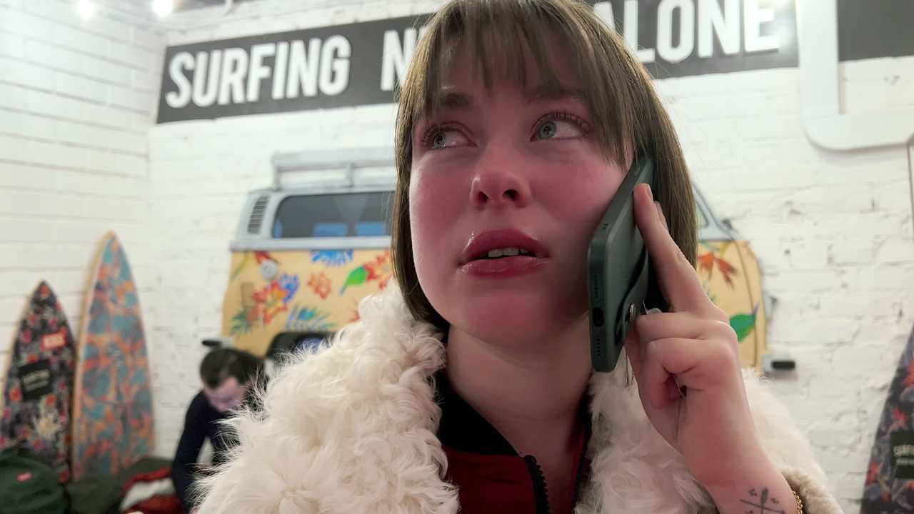 a woman on the phone with a fur collar