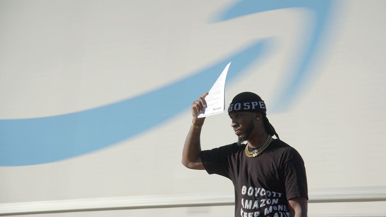 Man in shirt: Boycott Amazon, Keep money...