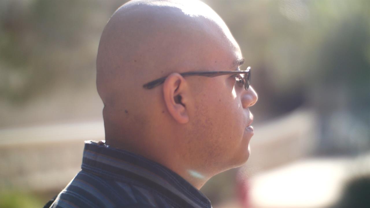 Closeup of bald man in sunglasses