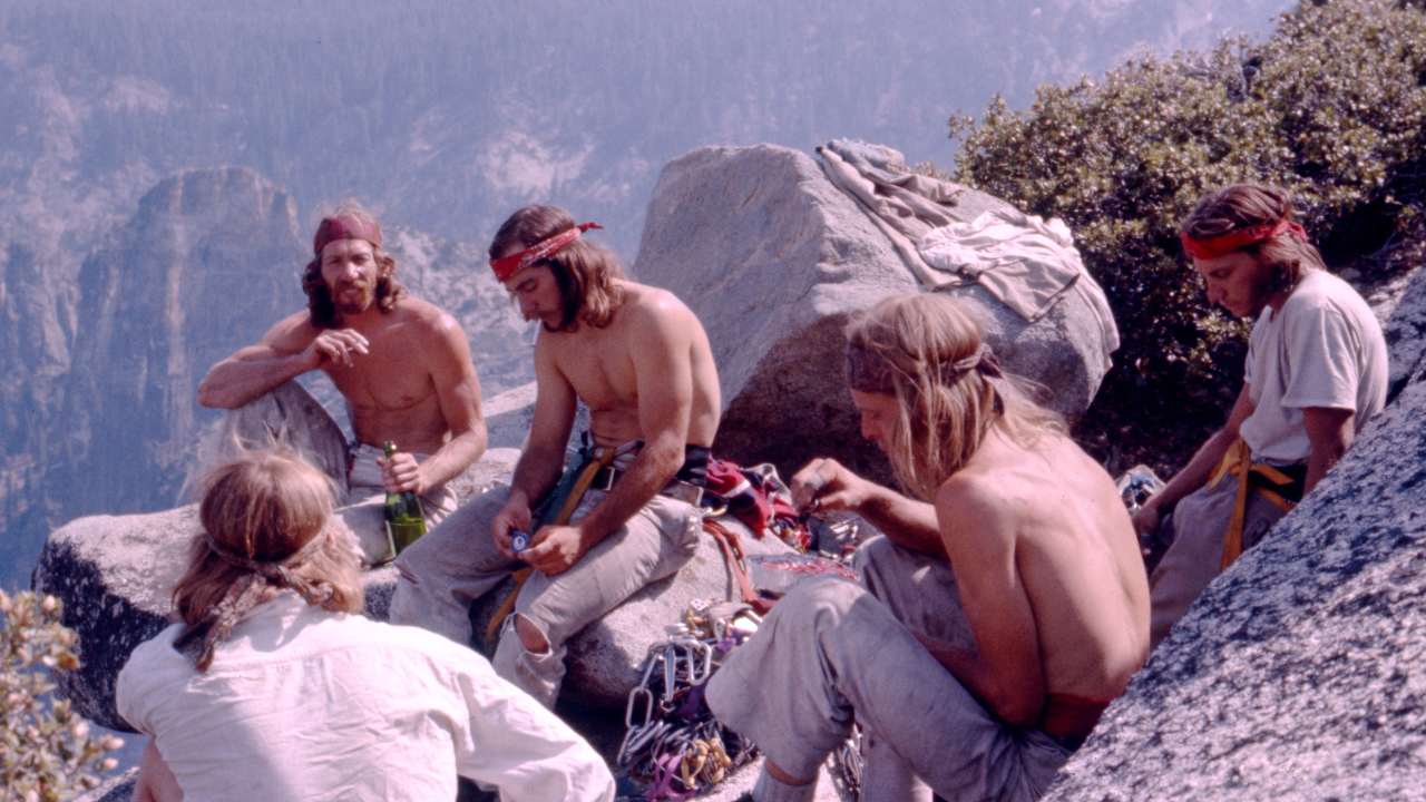 a group of men with long hair and headbands