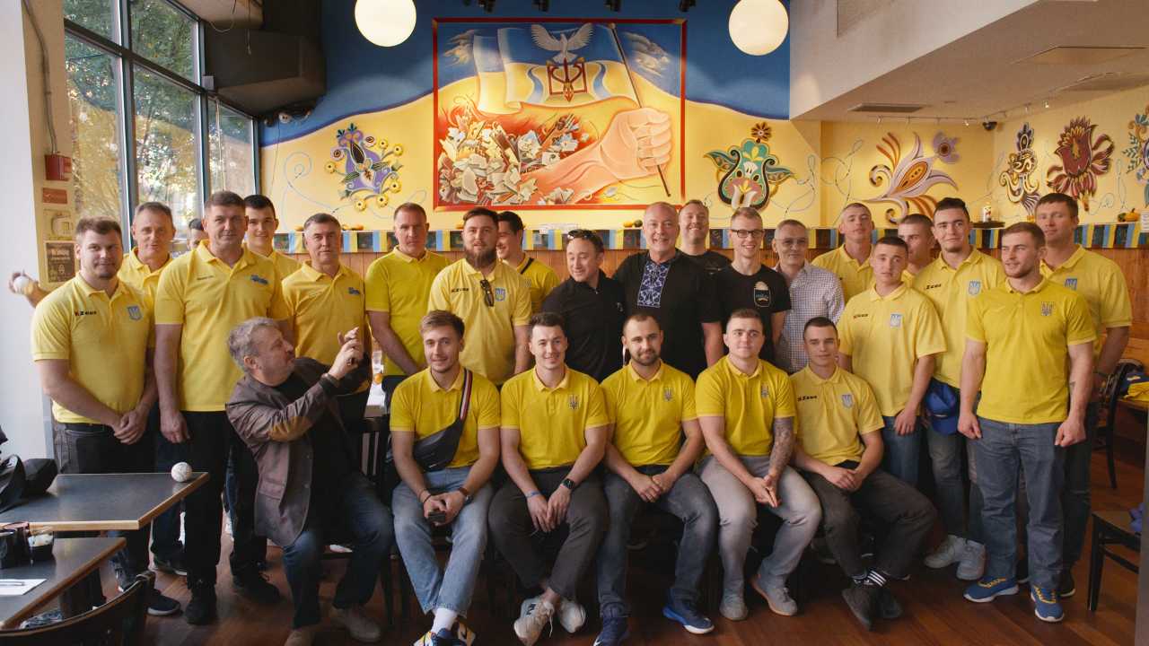 a large group of men in matching polo shirts