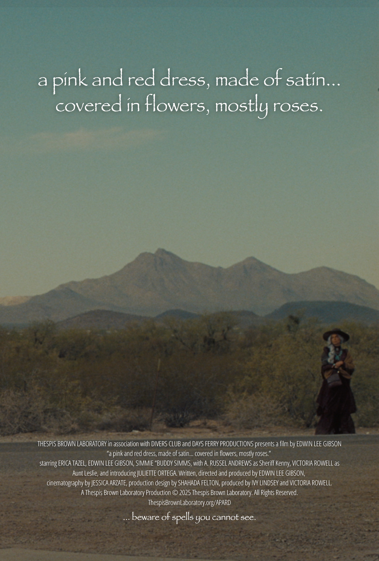 a pink and red dress, made of satin... covered in flowers, mostly roses.