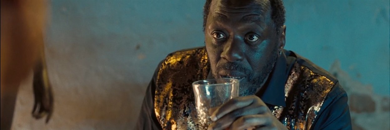 A pink and red dress made of satin... covered in flowers, mostly roses.