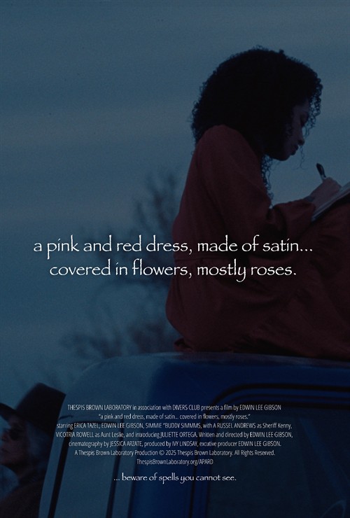 a pink and red dress, made of satin… covered in flowers, mostly roses. Trailer